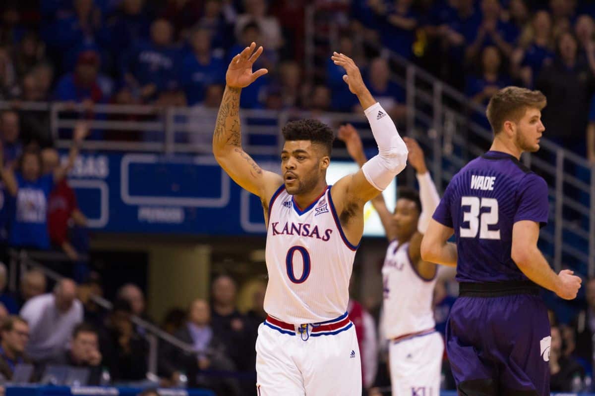 Kansas holds on, Louisville plummets